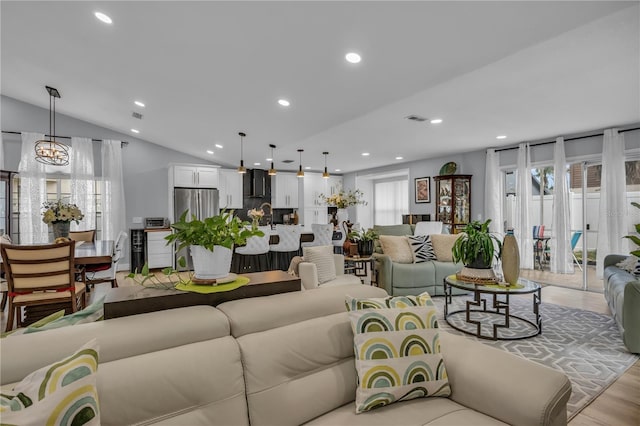 332 Wood Dove Ave, Tarpon Springs, FL 34689 - living area with recessed lighting, light wood-style flooring, and vaulted ceiling