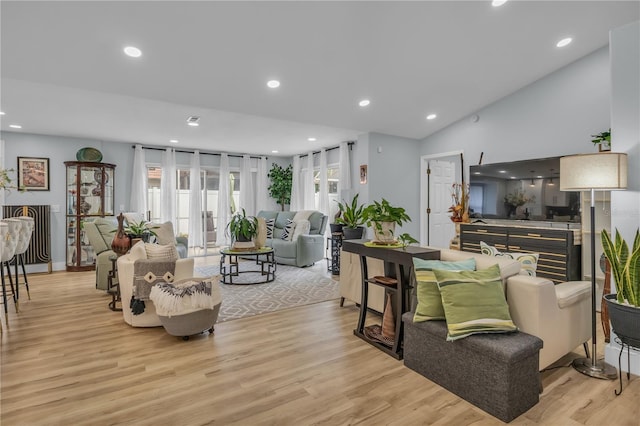 332 Wood Dove Ave, Tarpon Springs, FL 34689 - living area featuring light wood-style floors, lofted ceiling, and recessed lighting