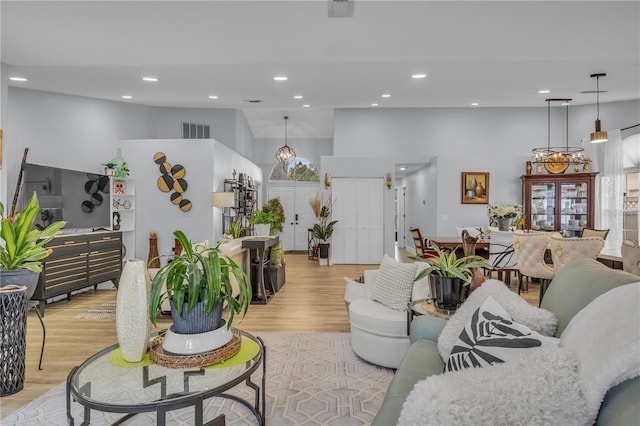 332 Wood Dove Ave, Tarpon Springs, FL 34689 - living area featuring light wood-style flooring, recessed lighting, and a chandelier