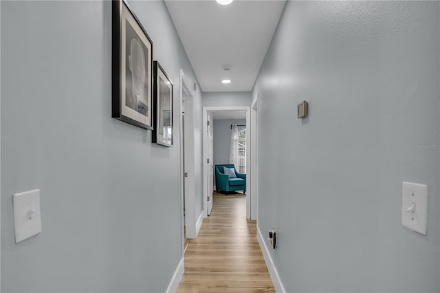 332 Wood Dove Ave, Tarpon Springs, FL 34689 - hall with baseboards, light wood-style flooring, and recessed lighting