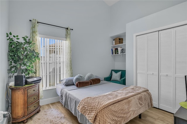 332 Wood Dove Ave, Tarpon Springs, FL 34689 - bedroom featuring wood finished floors, a closet, and baseboards