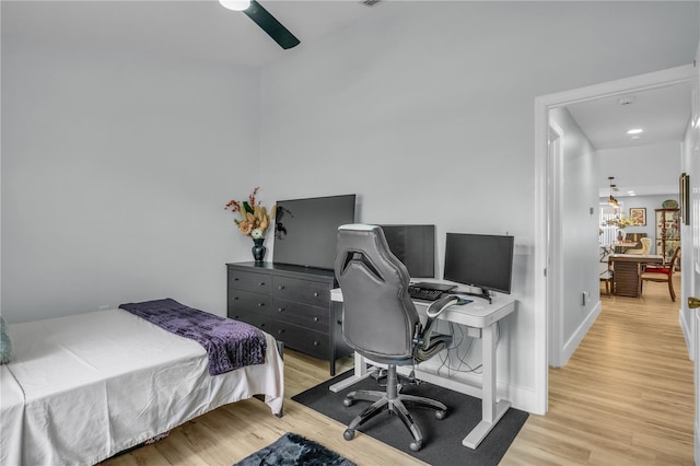 332 Wood Dove Ave, Tarpon Springs, FL 34689 - bedroom with light wood-type flooring, an office area, and ceiling fan