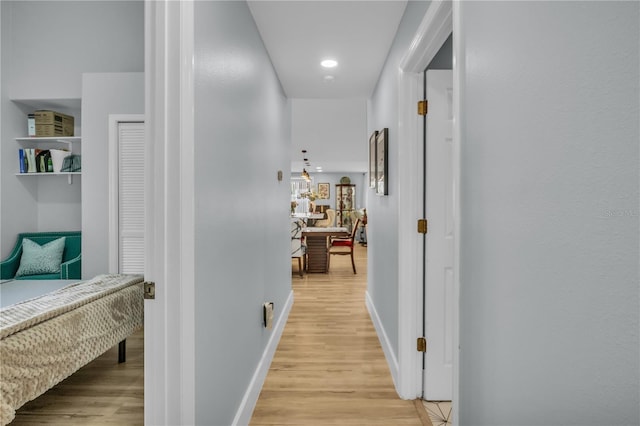 332 Wood Dove Ave, Tarpon Springs, FL 34689 - hall featuring light wood finished floors, baseboards, and recessed lighting