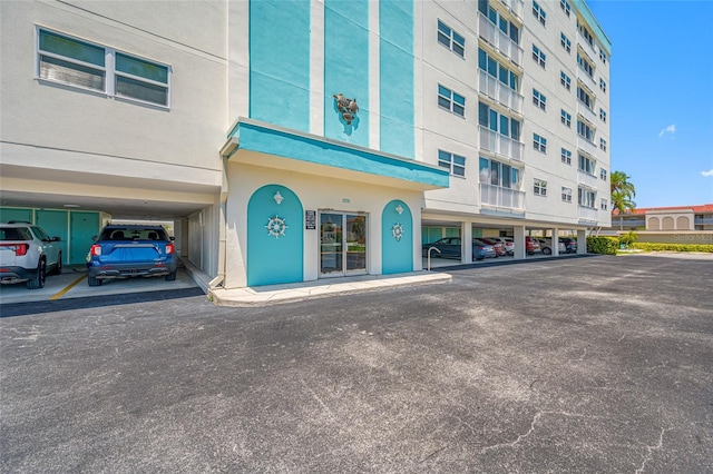 10216 Regal Dr Unit 208, Largo, FL 33774 - view of building exterior with covered parking