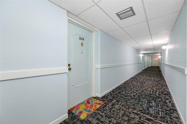 10216 Regal Dr Unit 208, Largo, FL 33774 - corridor with carpet floors, a drop ceiling, and baseboards
