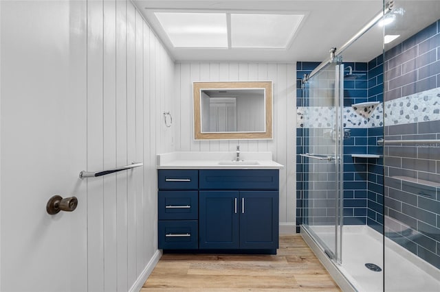 10216 Regal Dr Unit 208, Largo, FL 33774 - bathroom featuring a shower stall, wood finished floors, and vanity