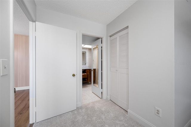 10216 Regal Dr Unit 208, Largo, FL 33774 - corridor with a textured ceiling and baseboards