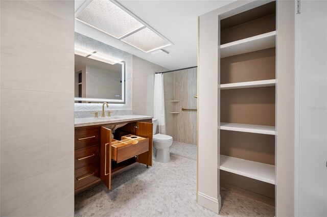 10216 Regal Dr Unit 208, Largo, FL 33774 - bathroom featuring toilet, vanity, and a shower with shower curtain