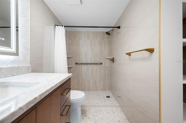 10216 Regal Dr Unit 208, Largo, FL 33774 - full bathroom featuring a tile shower, vanity, and toilet