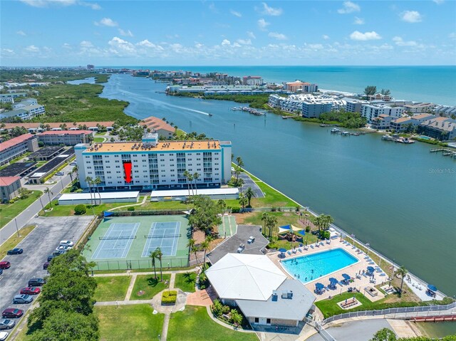 10216 Regal Dr Unit 208, Largo, FL 33774 - drone / aerial view of a large body of water, a pool area, and apartment complex / building