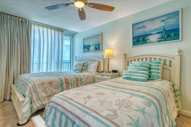 14146 Gulf Blvd Unit 4B, Madeira Beach, FL 33708 - bedroom featuring carpet, a textured ceiling, and ceiling fan
