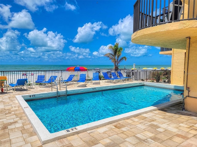 14146 Gulf Blvd Unit 4B, Madeira Beach, FL 33708 - community pool with a patio area, fence, and a water view