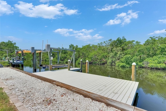 825 Seabreeze Dr, Ruskin, FL 33570 - dock with a water view and boat lift