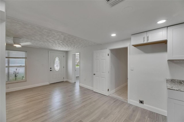 825 Seabreeze Dr, Ruskin, FL 33570 - entryway featuring light wood-style flooring, baseboards, a ceiling fan, and recessed lighting