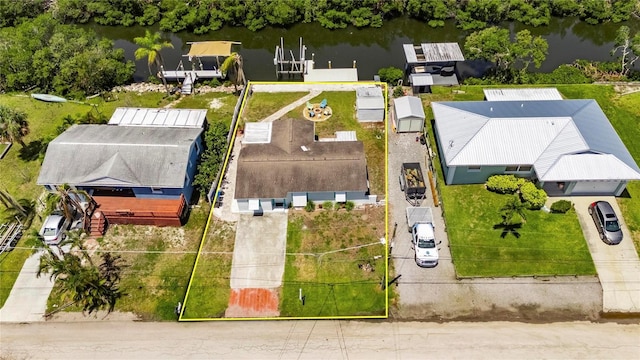 825 Seabreeze Dr, Ruskin, FL 33570 - aerial view of property and surrounding area featuring a large body of water and property boundaries highlighted
