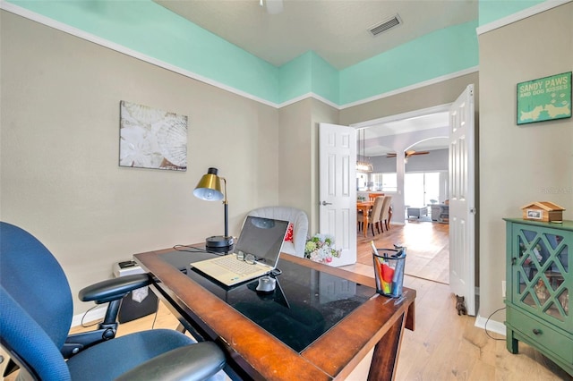 8504 Tidal Bay Ln, Tampa, FL 33635 - home office featuring arched walkways and wood finished floors