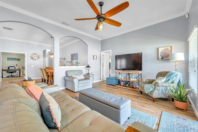 8504 Tidal Bay Ln, Tampa, FL 33635 - living area featuring wood finished floors, ceiling fan, baseboards, crown molding, and arched walkways