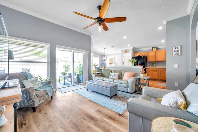 8504 Tidal Bay Ln, Tampa, FL 33635 - living room featuring ornamental molding, a ceiling fan, light wood-style floors, vaulted ceiling, and recessed lighting