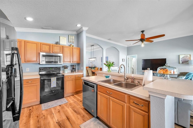 8504 Tidal Bay Ln, Tampa, FL 33635 - kitchen featuring appliances with stainless steel finishes, a sink, light wood finished floors, light countertops, and ornamental molding