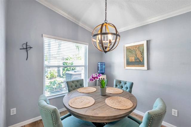 8504 Tidal Bay Ln, Tampa, FL 33635 - dining space with a chandelier, crown molding, baseboards, and wood finished floors