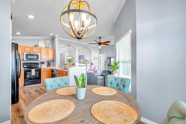 8504 Tidal Bay Ln, Tampa, FL 33635 - dining area featuring a chandelier, ceiling fan, crown molding, light wood finished floors, and baseboards