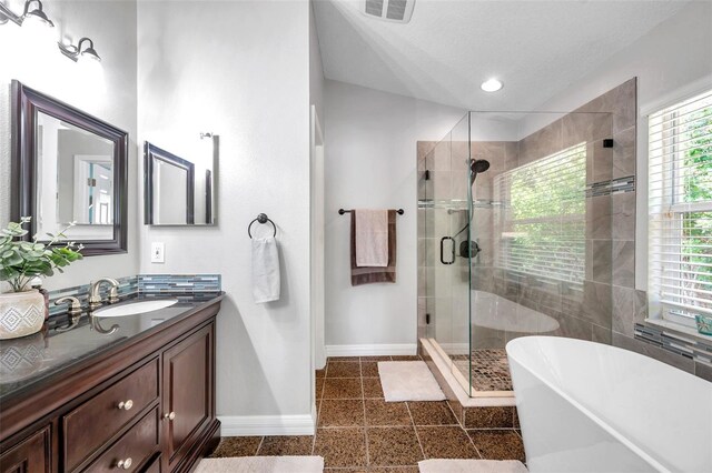 8504 Tidal Bay Ln, Tampa, FL 33635 - full bath with baseboards, vanity, a shower stall, a freestanding bath, and recessed lighting