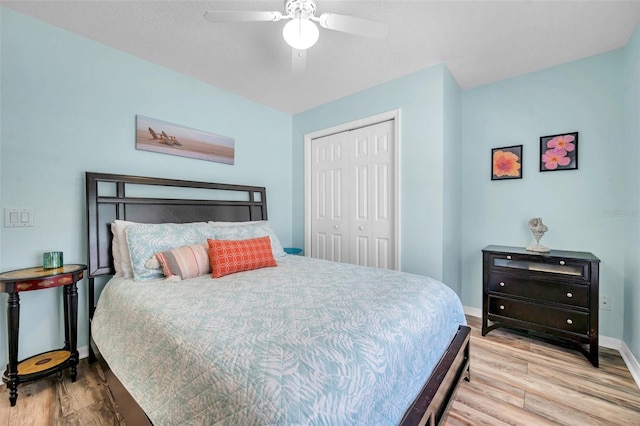 8504 Tidal Bay Ln, Tampa, FL 33635 - bedroom featuring a closet, wood finished floors, baseboards, and a ceiling fan