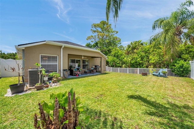 8504 Tidal Bay Ln, Tampa, FL 33635 - view of yard featuring central AC unit and a patio