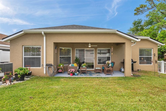 8504 Tidal Bay Ln, Tampa, FL 33635 - rear view of house with stucco siding, a patio area, ceiling fan, and central air condition unit