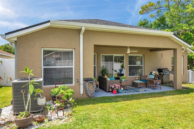 8504 Tidal Bay Ln, Tampa, FL 33635 - rear view of property featuring central air condition unit, a ceiling fan, a patio area, and stucco siding