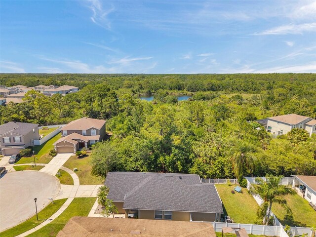 8504 Tidal Bay Ln, Tampa, FL 33635 - aerial view of residential area with a forest and a large body of water
