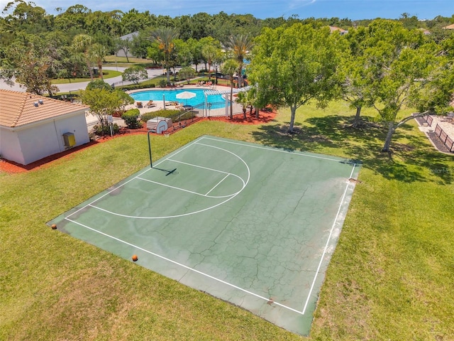 8504 Tidal Bay Ln, Tampa, FL 33635 - view of basketball court featuring a lawn and community basketball court