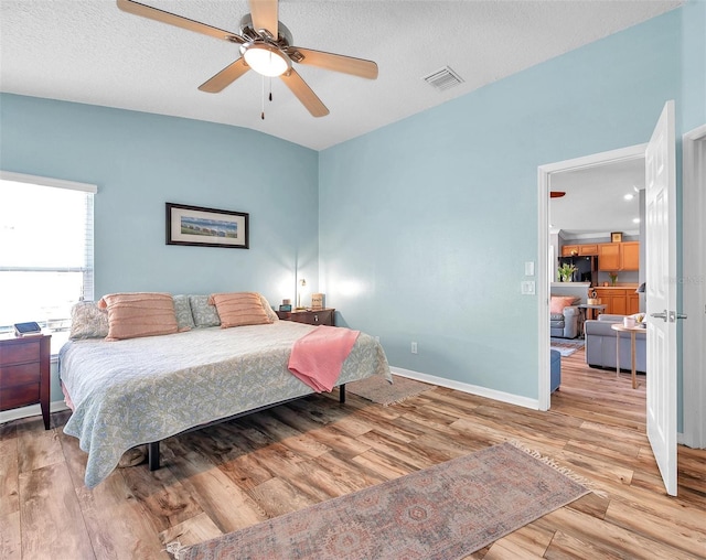 8504 Tidal Bay Ln, Tampa, FL 33635 - bedroom with wood finished floors, baseboards, and ceiling fan