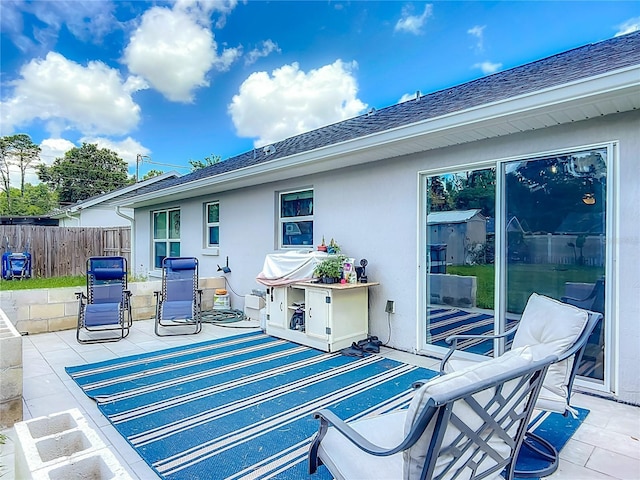 view of patio with fence