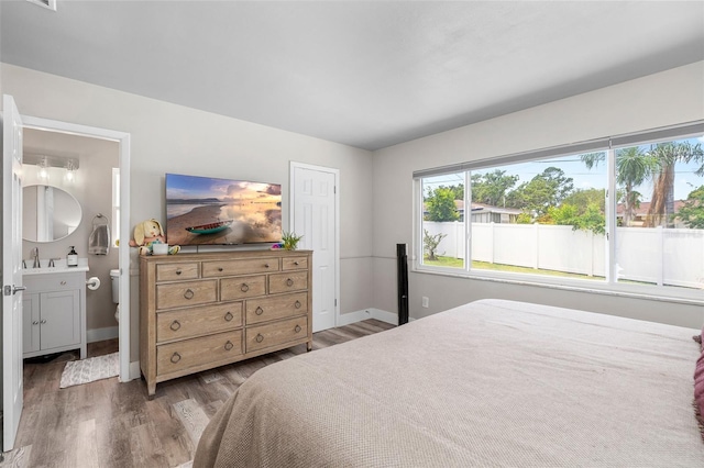 1530 Picardy Cir, Clearwater, FL 33755 - bedroom featuring wood finished floors and baseboards