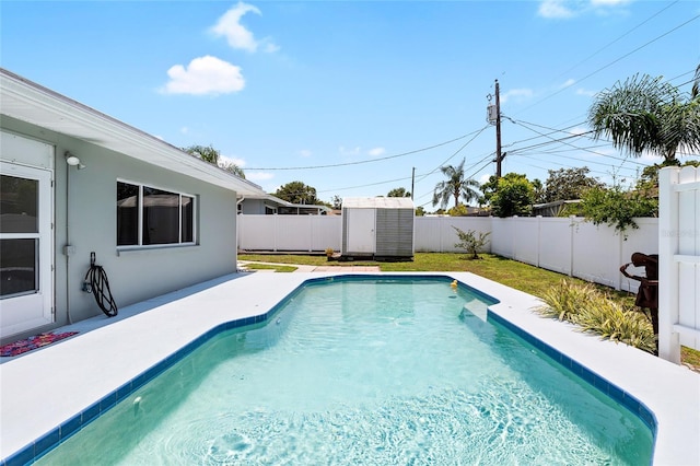 1530 Picardy Cir, Clearwater, FL 33755 - view of swimming pool featuring a fenced backyard and a storage unit