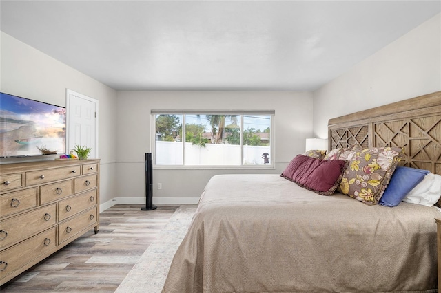 1530 Picardy Cir, Clearwater, FL 33755 - bedroom featuring light wood finished floors and baseboards