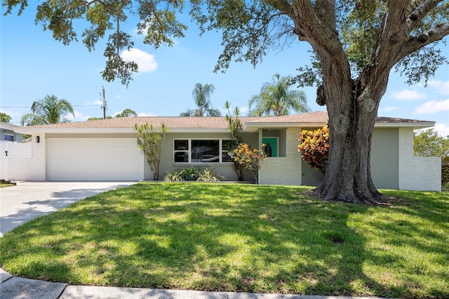 1530 Picardy Cir, Clearwater, FL 33755 - single story home featuring an attached garage, concrete driveway, a front yard, and brick siding