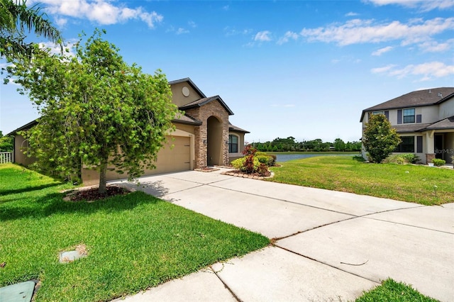 11878 Thicket Wood Dr, Riverview, FL 33579 - view of front of home with concrete driveway, stucco siding, an attached garage, a front lawn, and stone siding
