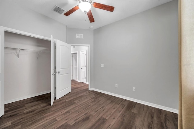 11878 Thicket Wood Dr, Riverview, FL 33579 - unfurnished bedroom with dark wood-type flooring, baseboards, and a closet