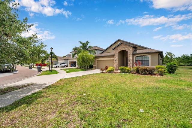11878 Thicket Wood Dr, Riverview, FL 33579 - view of front of house with driveway, a garage, a front lawn, and stucco siding