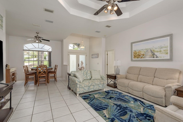 6129 Schalekamp Dr, Spring Hill, FL 34609 - living area with a ceiling fan, light tile patterned flooring, a raised ceiling, and french doors