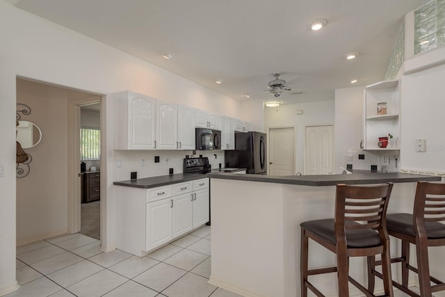 6129 Schalekamp Dr, Spring Hill, FL 34609 - kitchen with black appliances, open shelves, dark countertops, backsplash, and recessed lighting
