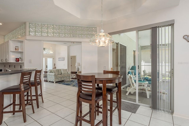 6129 Schalekamp Dr, Spring Hill, FL 34609 - dining room featuring a chandelier and light tile patterned floors