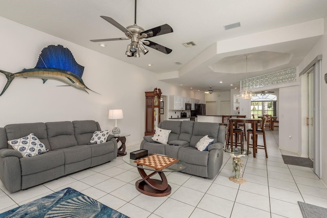 6129 Schalekamp Dr, Spring Hill, FL 34609 - living room with light tile patterned floors, ceiling fan, recessed lighting, baseboards, and a raised ceiling