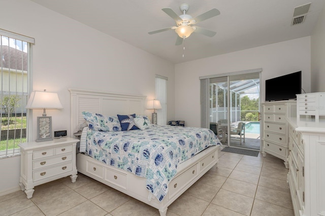 6129 Schalekamp Dr, Spring Hill, FL 34609 - bedroom with access to exterior, multiple windows, light tile patterned floors, and ceiling fan