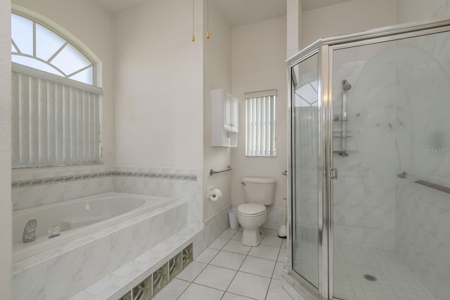 6129 Schalekamp Dr, Spring Hill, FL 34609 - full bathroom featuring toilet, a shower stall, a bath, and tile patterned floors