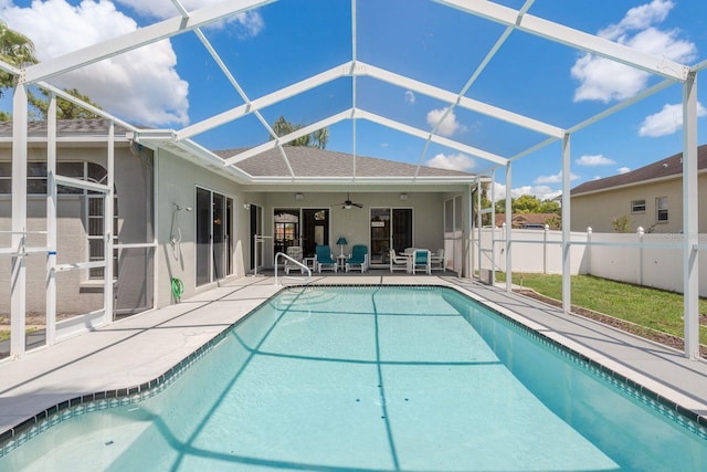 6129 Schalekamp Dr, Spring Hill, FL 34609 - view of swimming pool with ceiling fan, a patio area, fence, and glass enclosure