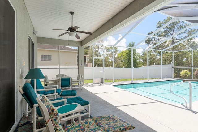 6129 Schalekamp Dr, Spring Hill, FL 34609 - view of swimming pool featuring a patio, ceiling fan, fence, a lanai, and outdoor dining space