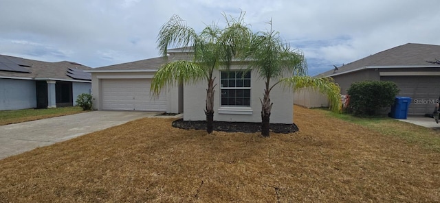 ranch-style home with an attached garage, driveway, a front lawn, and stucco siding